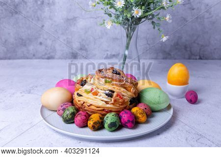 Craffin (cruffin) With Raisins, Nuts And Candied Fruits. Easter Bread Kulich And Painted Eggs. Easte