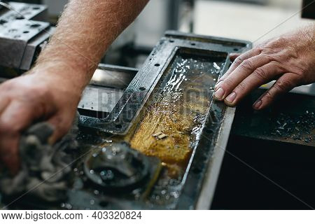 Service And Repair Of Machine Tools In A Machine Shop Or Workshop. These Are The Hands Of A White Ma