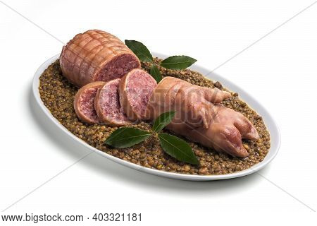 Stuffed Pig Foot On Lentils With Bay Leaf In Oval Plate