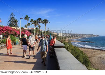 Gran Canaria, Spain - December 1, 2015: People Visit Playa Ingles Oceanfront Walkway In Maspalomas, 