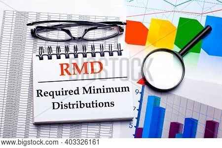 Glasses, Magnifier, Color Charts And A White Notepad With Text Rmd Required Minimum Distributions On