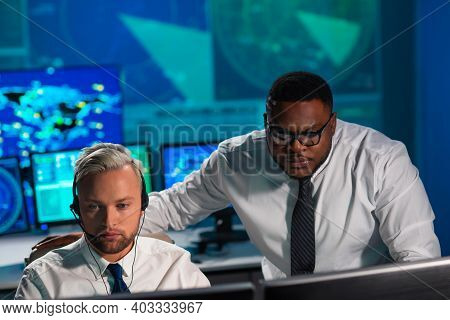 Workplace Of The Air Traffic Controllers In The Control Tower. Diverse Team Of Aircraft Control Offi