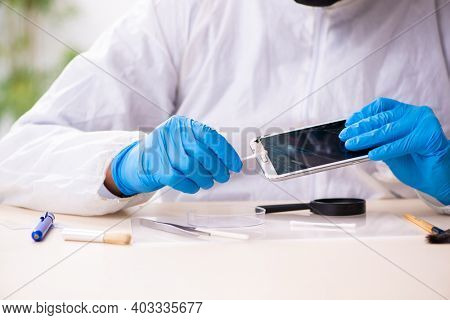 Male expert criminologist working in the lab for evidence