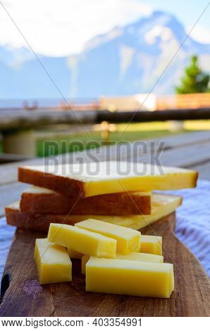 Cheese Collection, French Comte, Beaufort Or Abondance Cow Milk Cheese Served Outdoor With Alps Moun