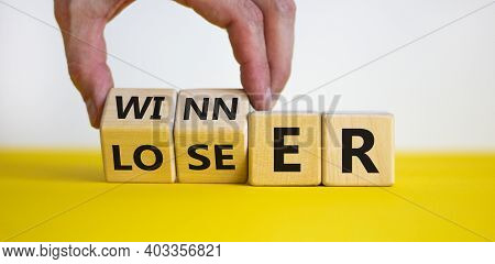 Loser Or Winner Symbol. Businessman Hand Turns Cubes And Changes The Word 'loser' To 'winner'. Beaut