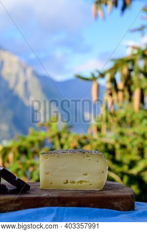 Cheese Collection, French Tomme De Savoie Or Tome Des Bauges Cheese And Dark Chocolate Served Outdoo