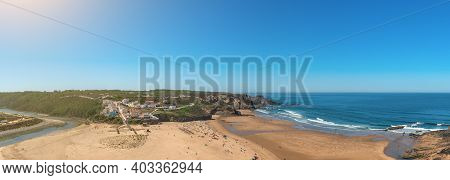 Delightful Panoramic View Of The Portuguese Beach Of The Village Of Odeceixe With Tourists In Summer