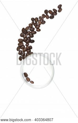 A Glass Of Milk With Coffee Beans Inside And A Little Outside. View From Above. Isolated
