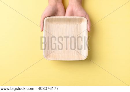 Hand Holding Betal Palm Leaf Plate (biodegradable, Compostable, Disposable Or Eco Friendly Plate) On