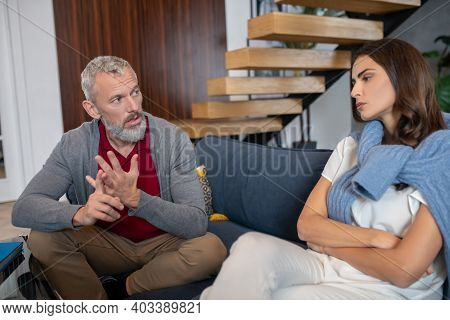 Grey-haired Man Moralizing His Young And Beautifuls Pouse