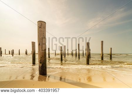 Long Exposure Seascape In Retro Colors. Taken At The North Sea In Petten With The Pole Village In Th