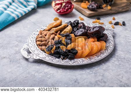 Dried Fruits And Nuts Mix In A Wooden Bowl. Assortment Of Candied Fruits. Judaic Holiday Tu Bishvat.