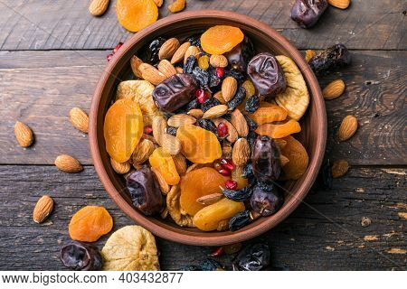 Dried Fruits And Nuts Mix In A Wooden Bowl. Assortment Of Candied Fruits. Judaic Holiday Tu Bishvat.