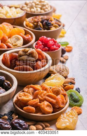 Dried Fruits And Nuts Mix In A Wooden Bowl. Assortment Of Candied Fruits. Judaic Holiday Tu Bishvat.