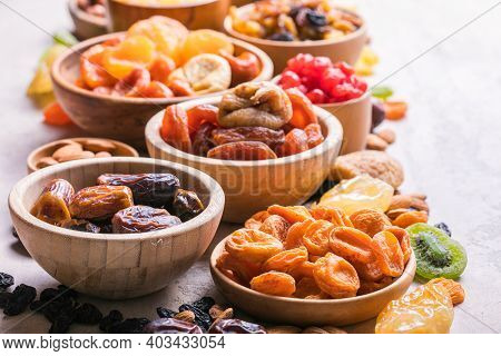 Dried Fruits And Nuts Mix In A Wooden Bowl. Assortment Of Candied Fruits. Judaic Holiday Tu Bishvat.