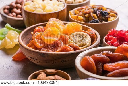Dried Fruits And Nuts Mix In A Wooden Bowl. Assortment Of Candied Fruits. Judaic Holiday Tu Bishvat.