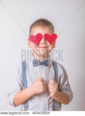 Five Year Old Smiling Boy Holding A Red Heart On Eays  Symbol Of Love, Family, Hope. Backgrounds For