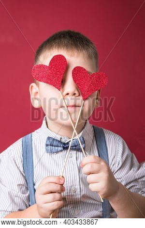 Five Year Old Smiling Boy Holding A Red Heart On Eays  Symbol Of Love, Family, Hope. Backgrounds For