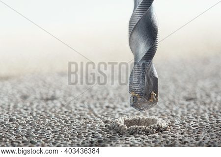 Metal Drill Bit Make Holes In Concrete Wall On Industrial Drilling Machine With Shavings. Metal Work