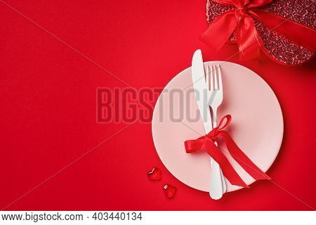 Valentines Day Background Or Concept With Empty Pink Plate And Whiteware On Scarlet Or Red Backgroun