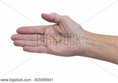 Horizontal Shot Of A Right Hand Palm Up Holding A Single Penny During The Pandemic.