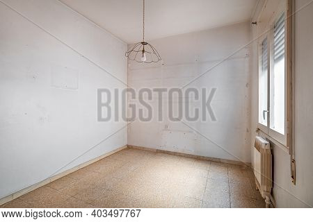 Empty, Old And Dirty Room With White Walls And Traces Of Shelves