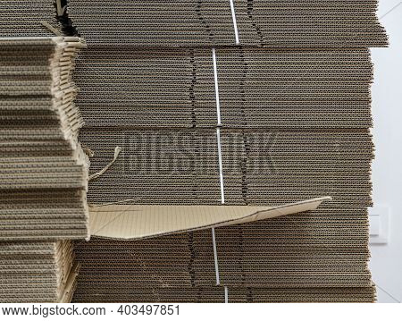 New Carton Boxes For Packing Are Stacked In A Stock