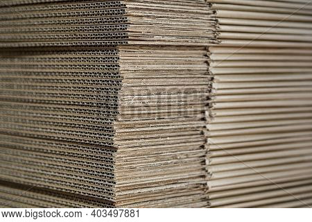 New Cartons For Packing Are Stacked In A Stock