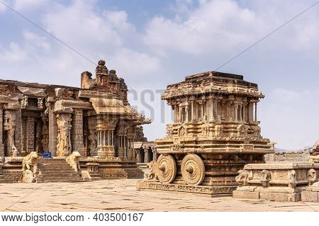 Hampi, Karnataka, India - November 5, 2013: Vijaya Vitthala Temple. Brown Stone Chariot In Front Of 
