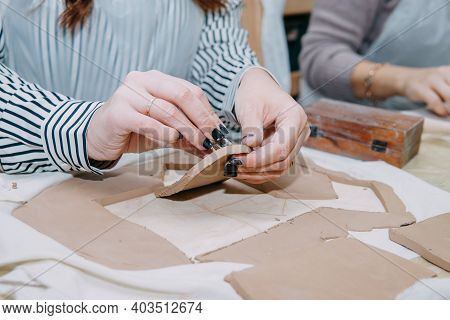 Women's Hands Knead Clay, Drawing Elements Of The Product. Production Of Ceramic Products At The Mas