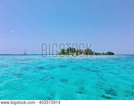 Sailboat Anchored Off A Beautiful Island In Belize Off The Belize Barrier Reef
