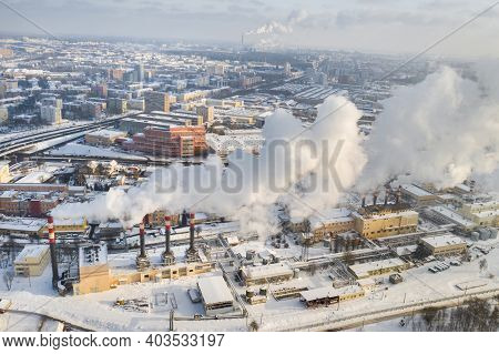 In The Winter City, The Factory's Chimneys Are Smoking. The Concept Of Air Pollution. Environmental
