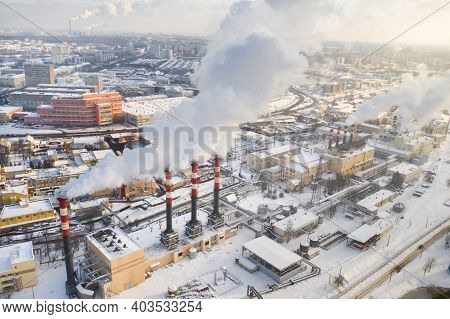 In The Winter City, The Factory's Chimneys Are Smoking. The Concept Of Air Pollution. Environmental