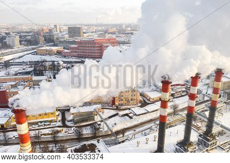 In The Winter City, The Factory's Chimneys Are Smoking. The Concept Of Air Pollution. Environmental