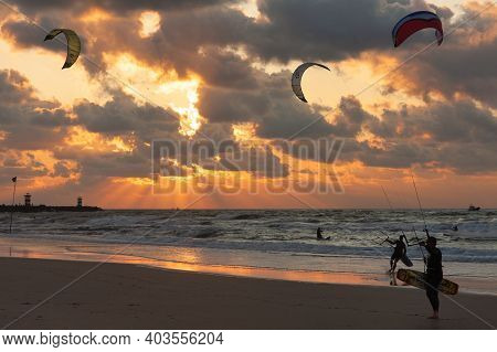 Scheveningen, The Netherlands - September 29, 2008: Kite Surfing In The Sunset At The Beach Of Schev
