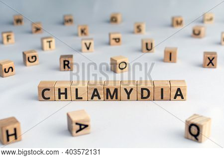 Chlamydia - Word From Wooden Blocks With Letters, Parasitic Bacterium Chlamydia Concept, Random Lett