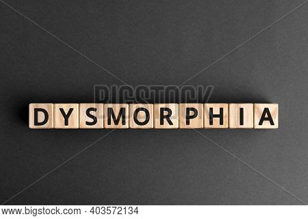 Dysmorphia - Word From Wooden Blocks With Letters, Body Dysmorphic Disorder Concept, Gray Background