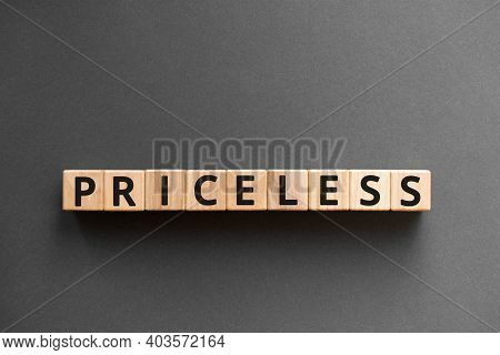 Priceless - Word From Wooden Blocks With Letters, High Value Extremely Funny Things Priceless Concep