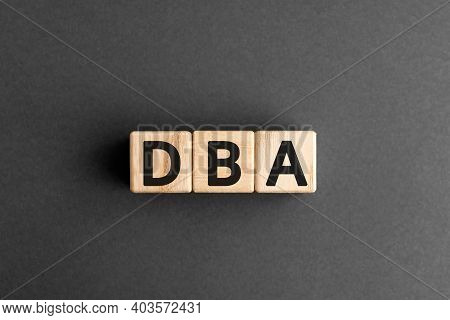 Dba - Acronym From Wooden Blocks With Letters, Database Administrator Or Doing Business As Abbreviat