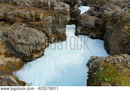 Beautiful Blue River And Rock Formations At Barnafoss Waterfalls In Western Iceland