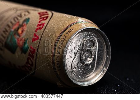 Birra Moretti, A Premium Lager Beer With Water Droplets On Black Background. Studio Photo Shoot In B
