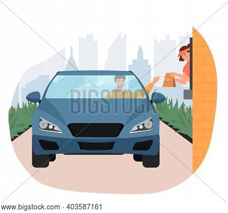 Male Customer In Car Holds Out His Hand To Take His Order From Restaurant Employee At The Drive Thru