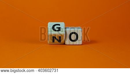 No Or Go Symbol. Turned A Cube, Changed The Word 'no' To 'go'. Beautiful Orange Background. Copy Spa