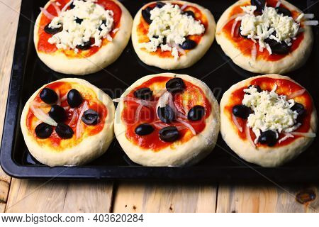 Mini Pizza Cooking. Home-made Fast Food. Soft Focus.