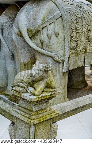 Stone Carved Ox, Which Represents The Chinese Horoscope, On Corner Post Of Concrete Fence.