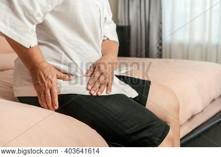 Hip Pain Of Senior Woman At Home, Healthcare Problem Of Senior Concept