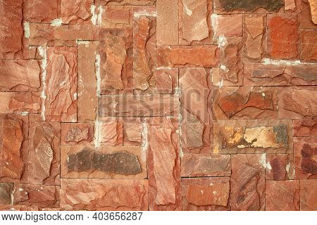 Texture Of An Old Red Brick Stone Wall With Scuffs And Scratches