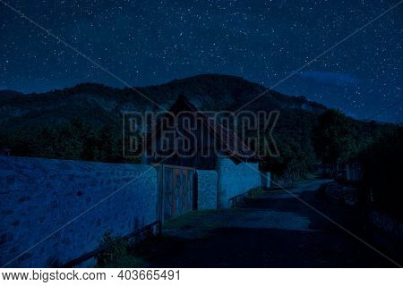 Old House With A Ghost In The Forest At Night Or Abandoned Haunted Horror House In Fog. Old Mystic B