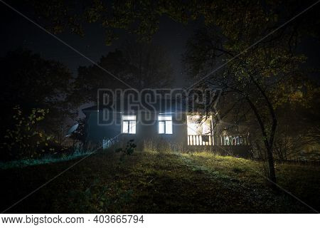 Mountain Night Landscape Of Building At Forest At Night With Moon Or Vintage Country House At Night