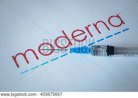 Riga, Latvia: January 12, 2021: Moderna Covid-19 Vaccine Concept. Close-up Of A Syringe And And, The